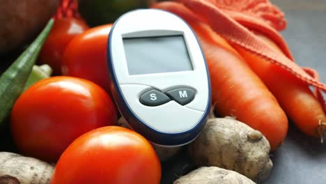 blood glucose meter with vegetables