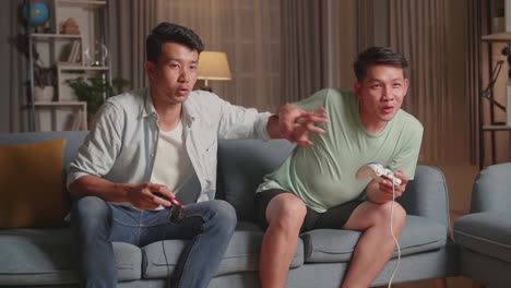 two friends enjoying video games at home