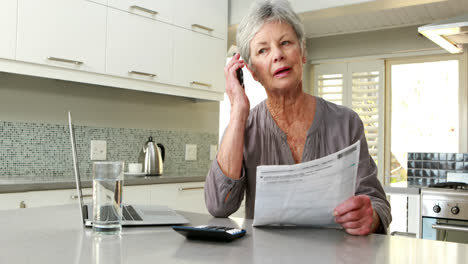 Happy-woman-using-a-calculator