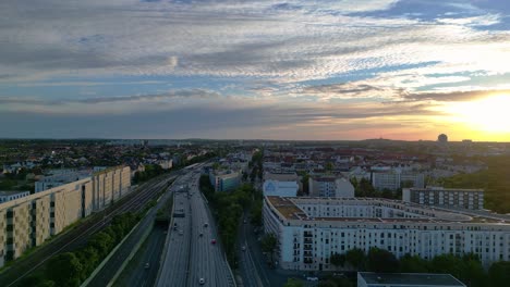 aerial view of a city highway at sunset