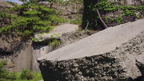 sea fortress ruins on tomogashima island, pan over broken building, japan