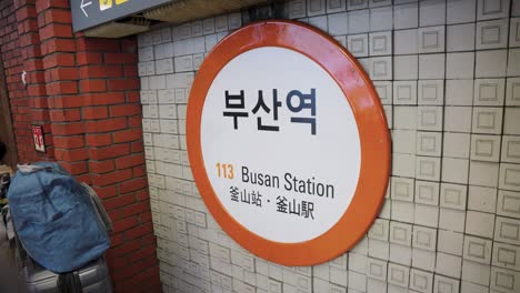 busan station establishing shot of subway signage in south korea