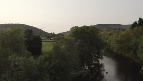 Flight-over-river-onto-grassland