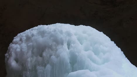 revealed frozen stream from the waterfall on ash cave of hocking hills state park in south bloomingville, ohio usa