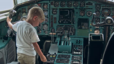 small kid on the cabin of an airplane