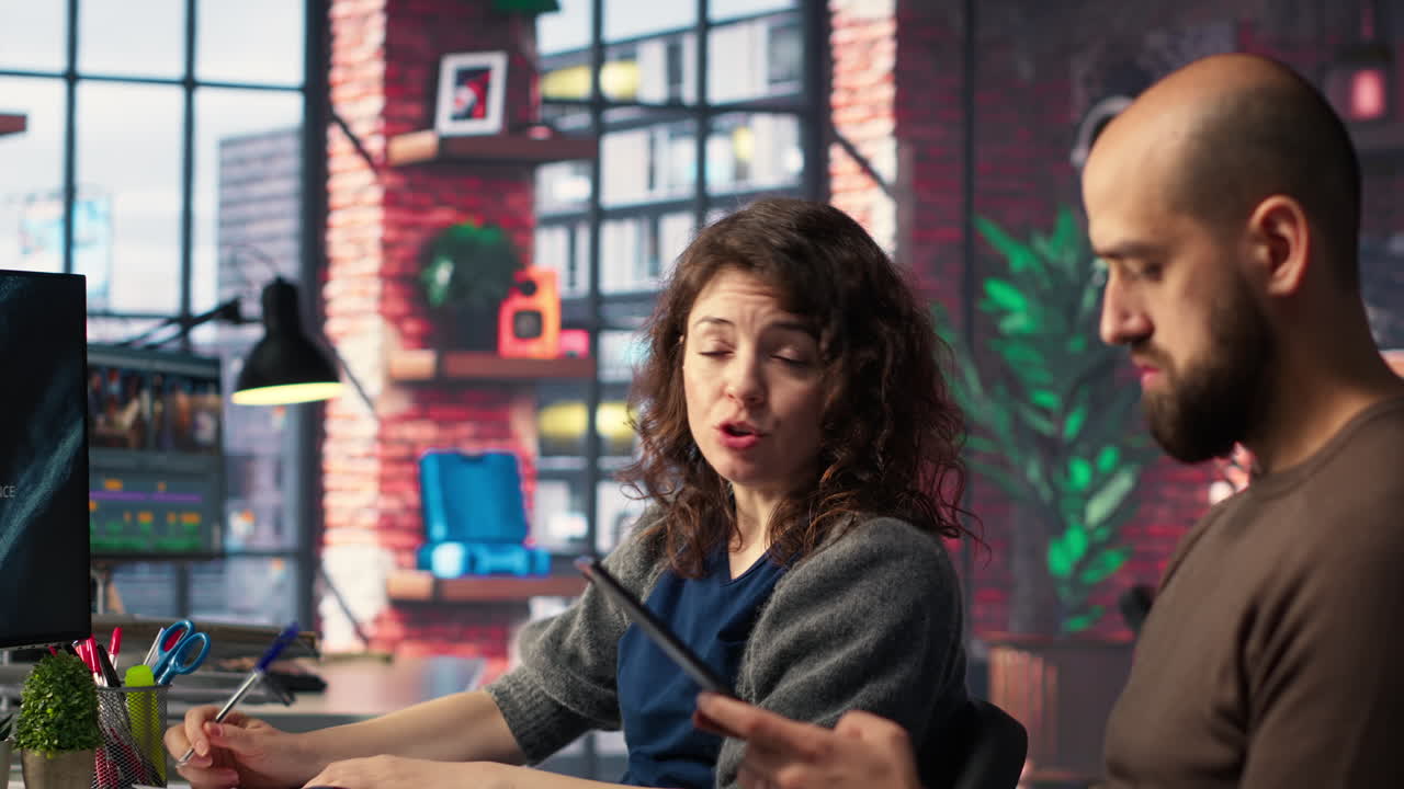 Team of analysts examining presentation charts and data on dashboard