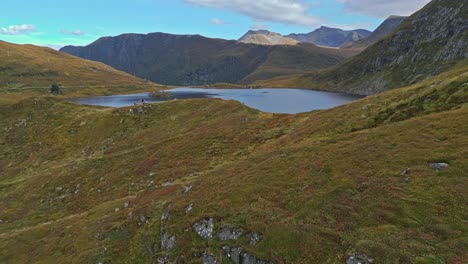 Aerial-over-the-rugged-hills-and-lakes-near-Vanylven-Municipality,-Norway