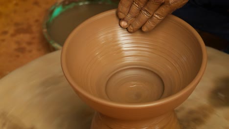 potter at work makes ceramic dishes. india, rajasthan.