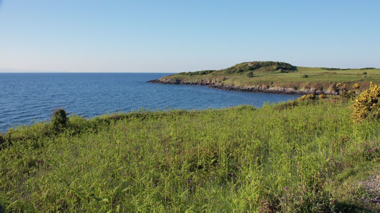 Extra wide shot Looking south on the rocky Shoreline at Hafan y Môr on Pen-y-chain, Pwllheli