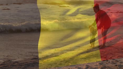 animación de la bandera de bélgica sobre una madre caucásica con un niño en la playa
