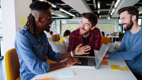coworkers collaborating and brainstorming in a modern office