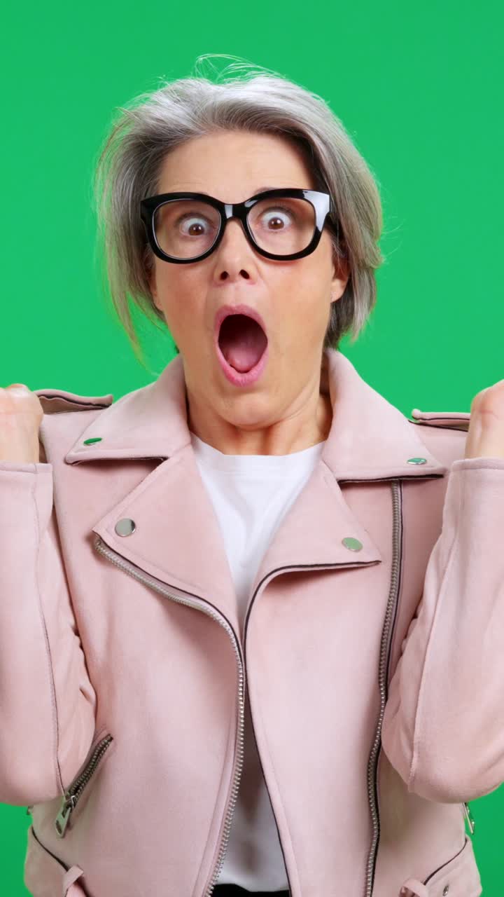 Middle-aged Woman Reacting with Surprise and Shock on Green Screen