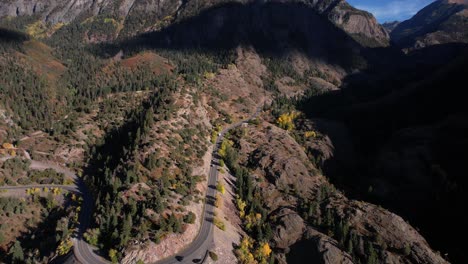 Aerial-View-of-Mountain-Pass-in-San-Juan-Mountains-Above-Ouray,-Colorado-USA-on-Sunny-Autumn-Day,-US-550-Route