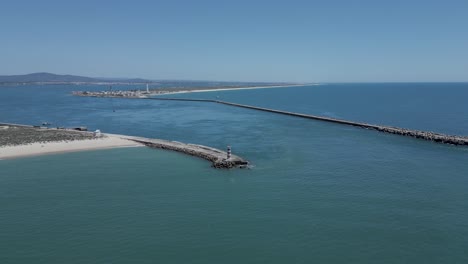 Aerial-seascape-view-of-lighthouse-in-desert-island,-in-Algarve-Tourism-Destination-Region,-in-Portugal-south-coast