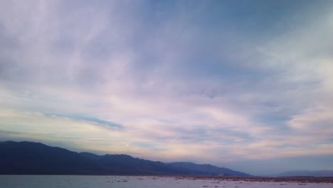 gimbal booming down shot from the sky to the salt flats at badwater basin in death valley, california