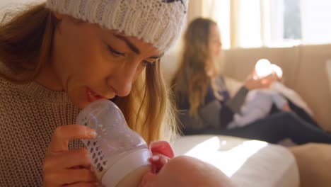 lesbian couple feeding milk to their babies 4k