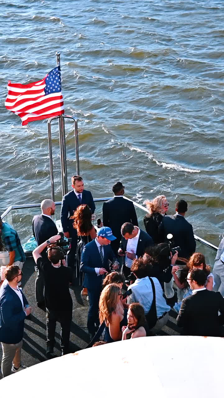 New York, USA, 8 July 2025: Thrilling NYC boat cruise. Group of people enjoying a boat cruise in New York, capturing memories while surrounded by water and skyline views
