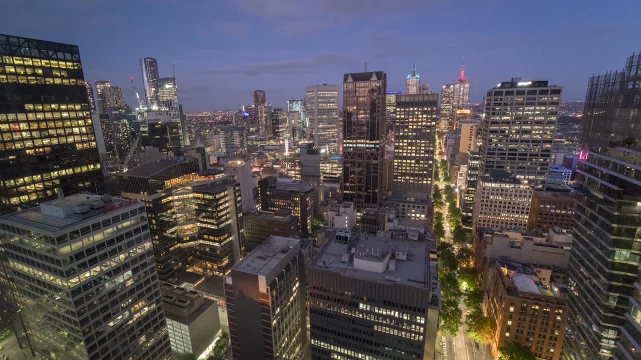 Melbourne City timelapse facing at the iconic Collins Street with day to night transition, capturing the golden sunset.