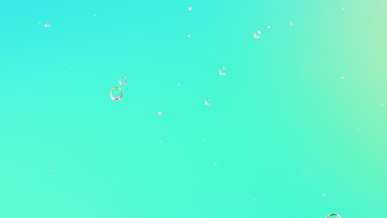 Animation of bubbles moving on blue background with copy space