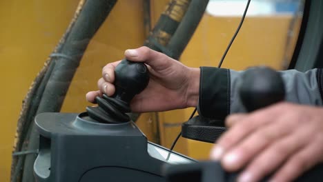 operator controlling an excavator controls