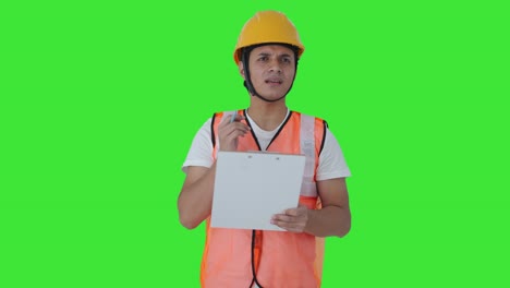 Confused-Indian-construction-labour-writing-notes-Green-screen