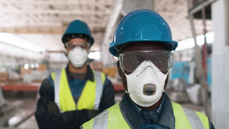 men wearing protective gear in factory