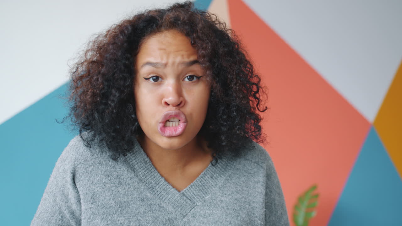 Woman with Curly Hair Making a Funny Face