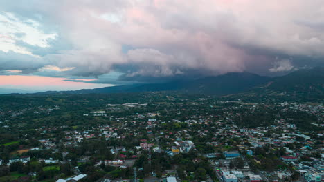 aerial timelapse in the city right before dusk, amazing environment in the city with colorful clouds fading