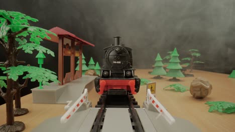 Toy Train Scene with Steam Engine and Train Station