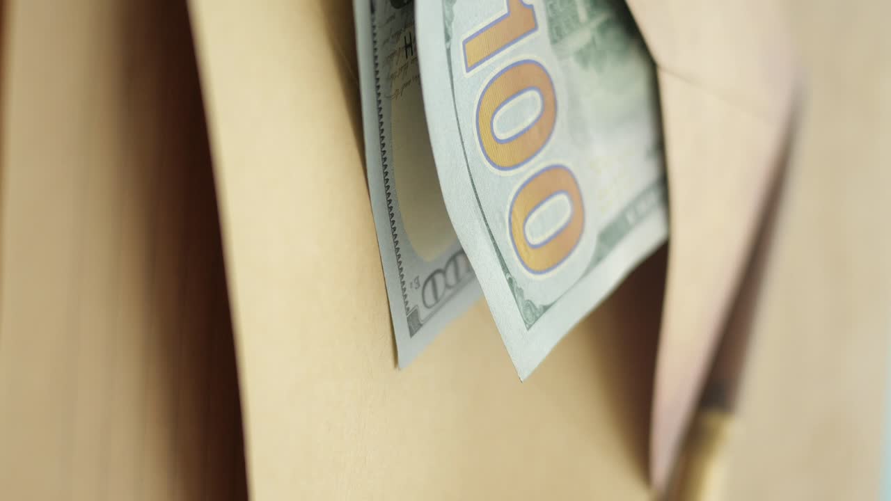 US 100 dollar bills in an envelope