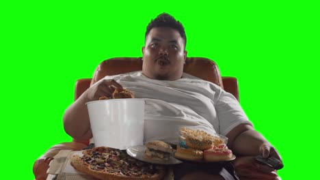 man watching tv while enjoying junk foods