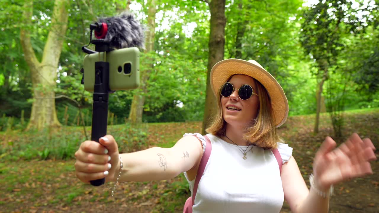 Woman Vlogging in a Park
