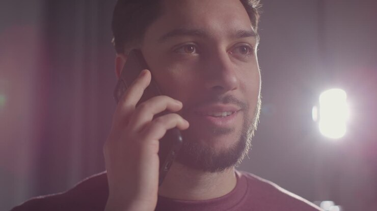 Pleased Young Man At Home Receiving Phone Call Confirming Job Offer 6