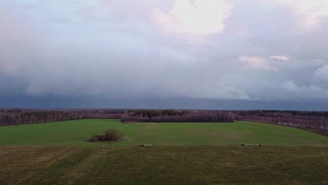 autumn storm clouds gliding above countryside landscape aerial view