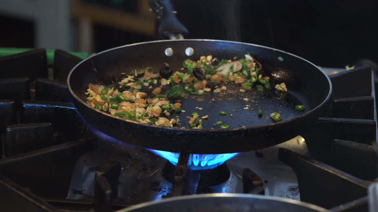 Chef Flambés Vegetables in a Hot Pan