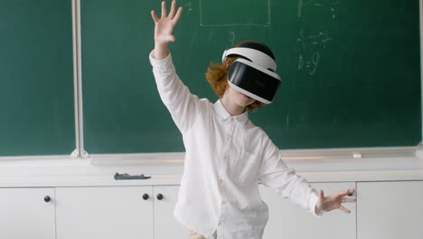 little boy playing with vr glasses.