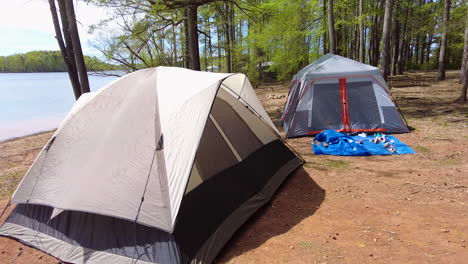 Camp-ground-with-tent-by-a-lake