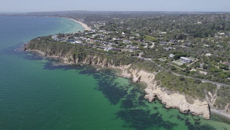 aerial view over the pillars and surrounding ocean in mount martha, australia - drone shot