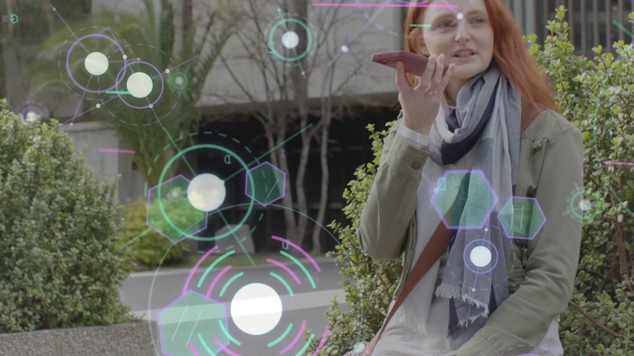 Woman raising phone speaking and recording message, camera pulling, AR hexagons overlaying for tech