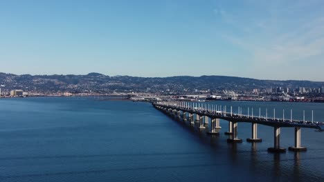 drone footage of the san francisco bay bridge taken from treasure island, california