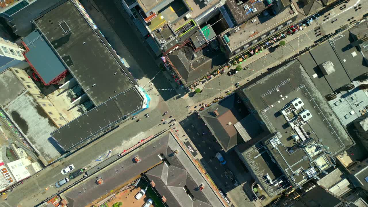 Rising overhead aerial of the Temple Bar area in Dublin, Ireland on a bright and sunny day. Filmed in 4K, 60FPS and with Rec709 color.