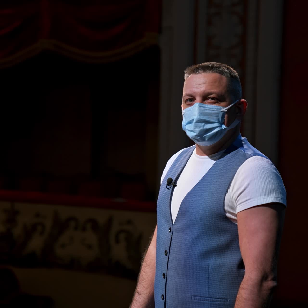 Man in mask at theatre