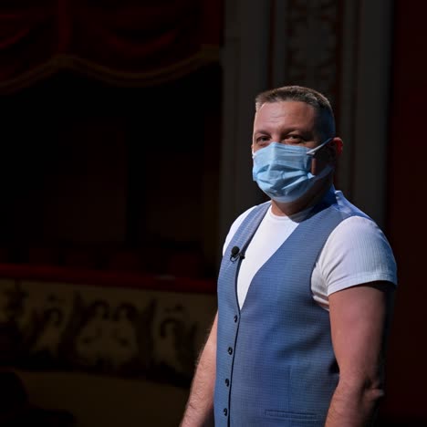 man in mask at theatre