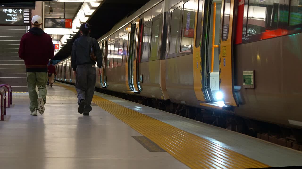 Train stops at the platform of Toowong station, Translink Queensland Rail