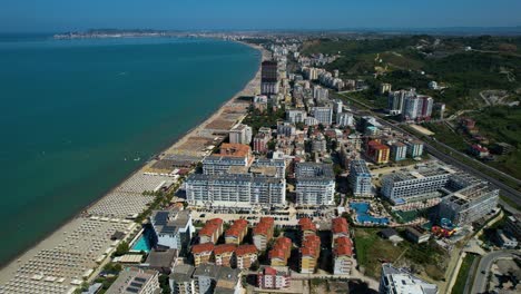 Hotels-and-Resorts,-Summer-Tourists-at-Durres-Beach-in-Albania:-Sandy-Shores,-Umbrellas,-and-Loungers,-Adriatic-Sea