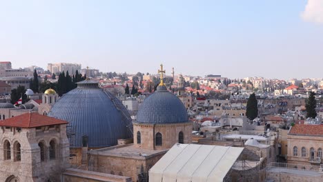 slow zooming on two domes and belfry of the church of the holy sepulchre in jerusalem