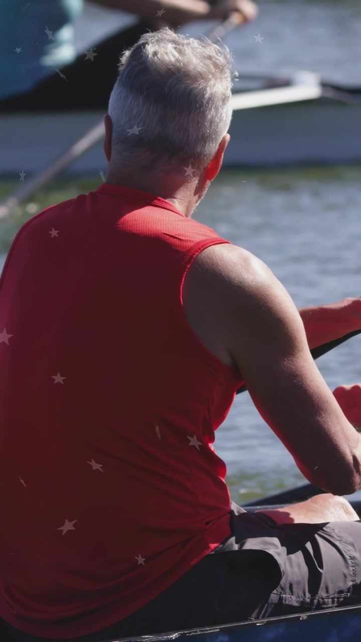 Vertical video: Male rower initiating drive, pulling oar, splashing water, rowing crew syncing