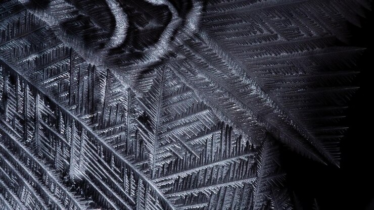 White crystal pattern forming from a freezing soap bubble