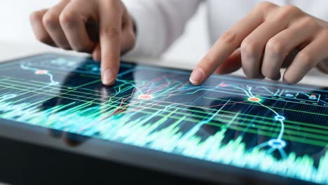 analyzing data visualizations: close-up view of hands interacting with touchscreen display featuring dynamic graphs and waveforms