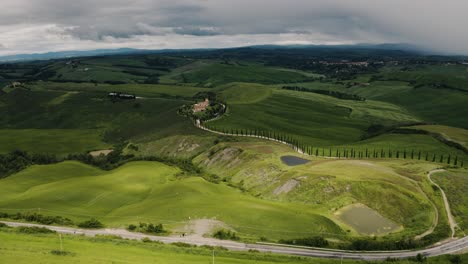 Aerial-view-of-dark-clouds-moving-over-Tuscany's-countryside-before-a-storm